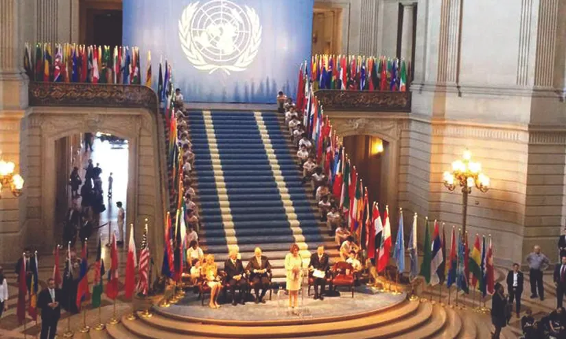 An image of Nancy Pelosi and several dignitaries at the United Nations Charter.