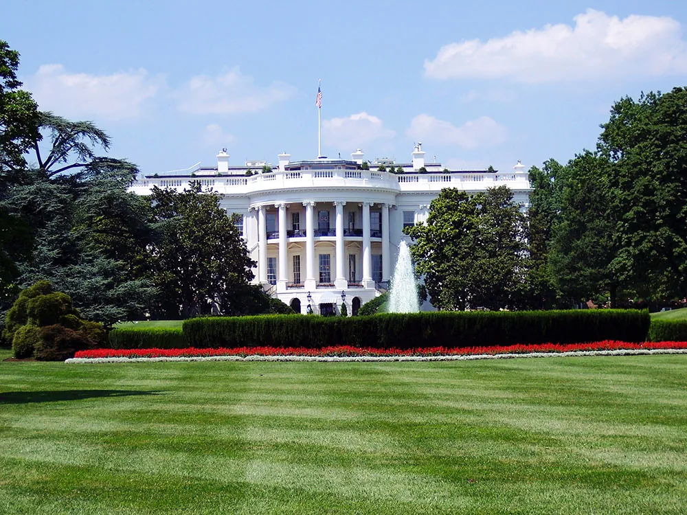A photo shows the exterior of the United States White House.