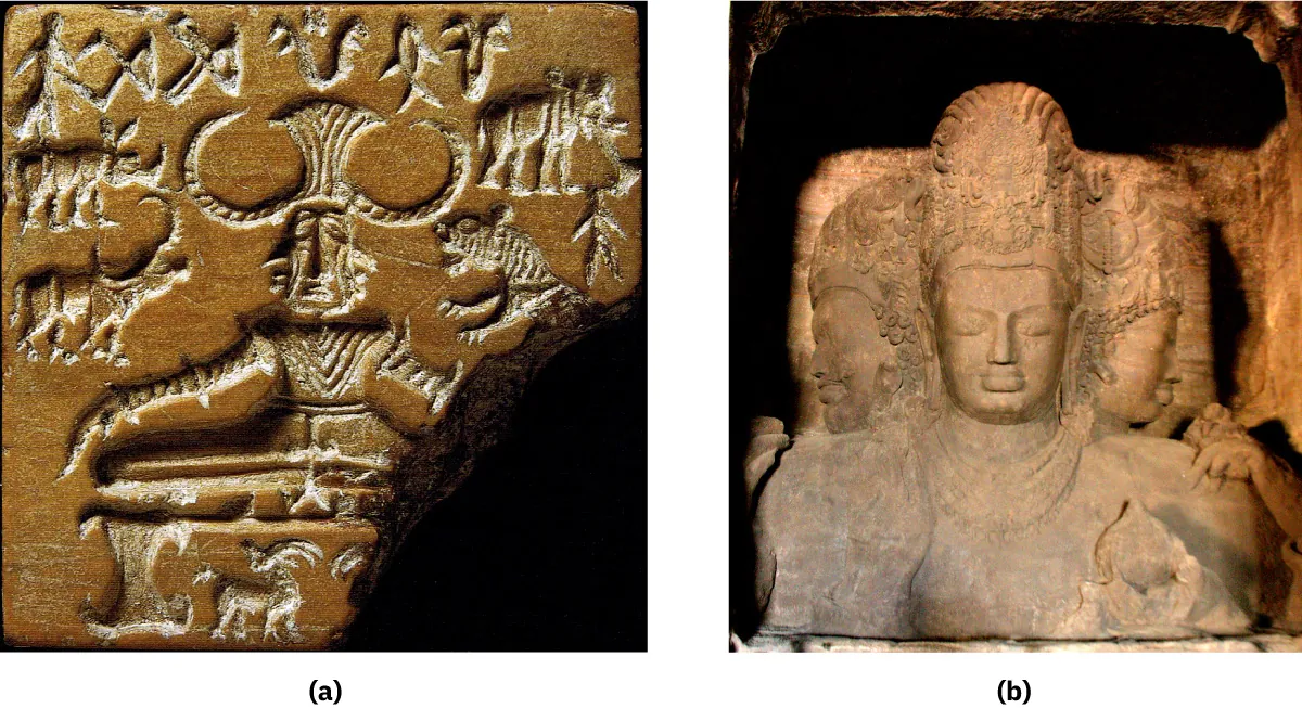 Two pictures are shown on a dark black background. (a) The first picture shows a caramel-colored stone carving with a large piece missing from the bottom right. The middle of the stone shows a man facing forward with a rectangular face, large nose, and almond shaped eyes. A face is also shown on either side of his head. He wears a large hat with round horns on both sides. He wears clothing with stripes all over and is sitting on a footed platform. There is a goat-type creature under the platform with two horns. Various animals can be seen around his head (two horned animals on the left, snake and fish type animals above his head and an elephant and tiger type animals on the right). A small carving of a person is seen to the far right. (b) This stone carving is colored off white and shows a person’s head and chest. They have full lips, closed eyes, and a highly etched tall headdress on their head. There is another head on either side of their head that appears similar. Rows of necklaces hang from their neck and there are some carvings seen on the bottom right of their chest. The background shows darker colored stone and black above the head.