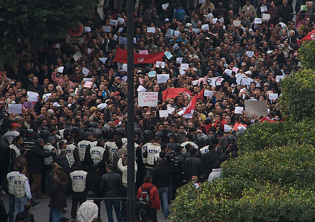 A large group of people marching in protest.