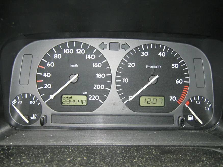 This photograph shows the instruments on a gray Volkswagen Vento dashboard, including the speedometer, odometer, and fuel and temperature gauges, showing some readings.