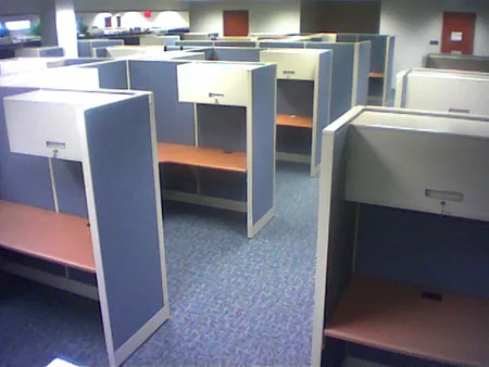 About 10 empty office cubicles are shown.