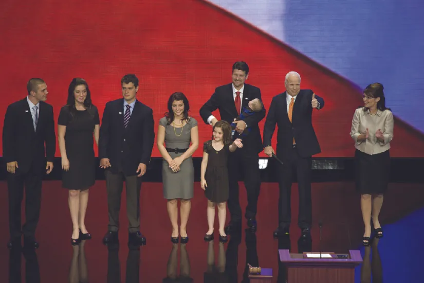 An image of Sarah Palin on a stage with John McCain and several other people.