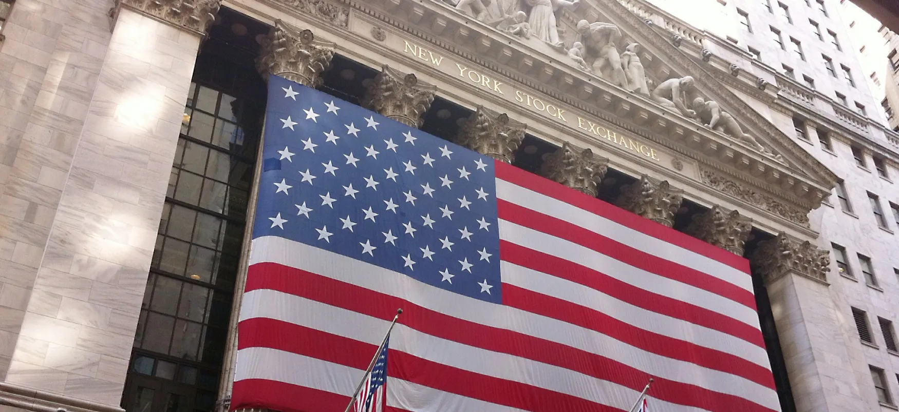 Huge US flag outside New York Stock Exchange.
