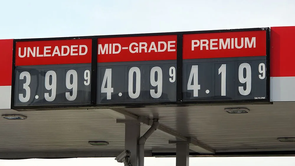A sign at a gas station shows the following prices: $3.99 for Unleaded; 4.09 for mid-grade; and 4.19 for Premium.