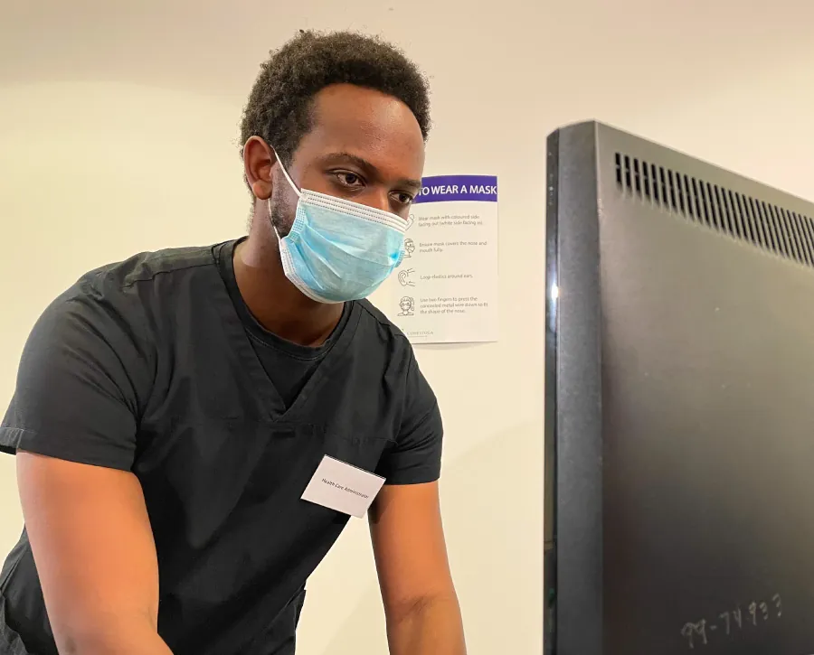 Healthcare professional looking at computer