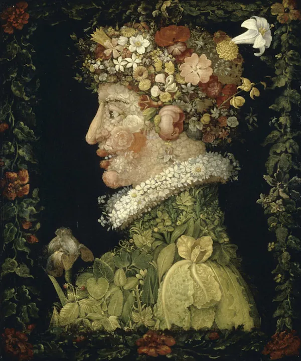 A photo shows a portrait human face made using different dried and fresh, flowers and leaves.