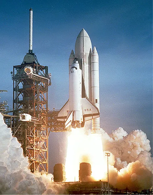Fotografía del transbordador espacial despegando.