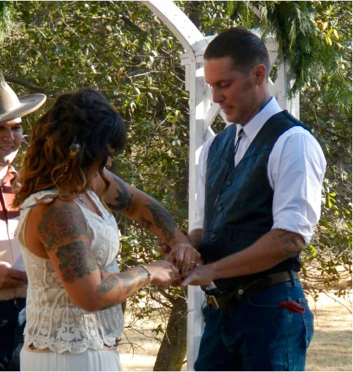 Photo of two individuals getting married.