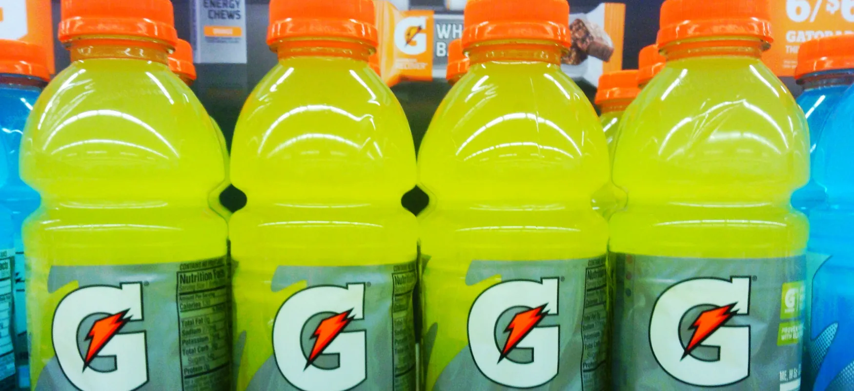 An 8-pack of Gatorade is on a shelf.