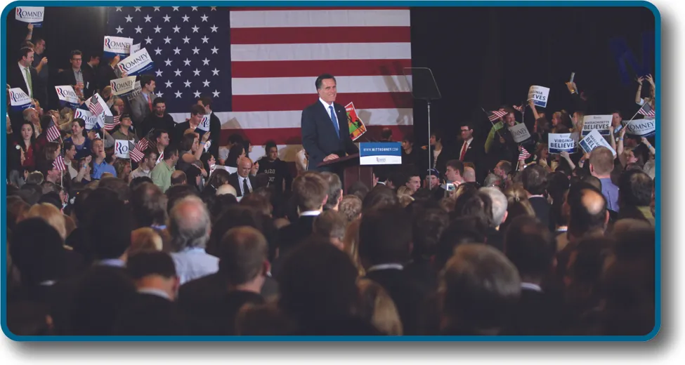 Photo of Mitt Romney in front of a crowd, smiling.
