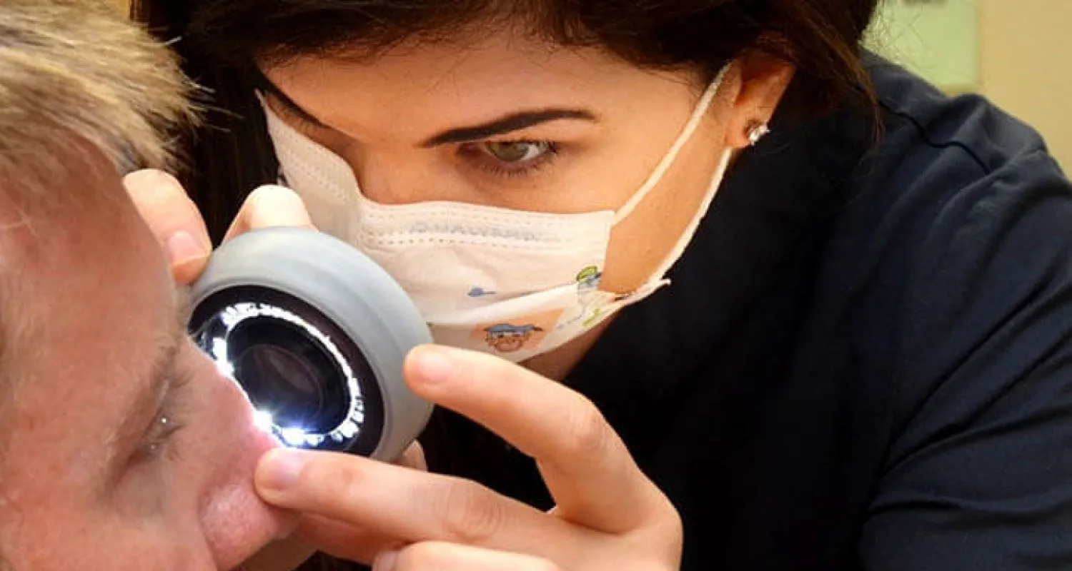 Healthcare provider performing an examination of a patient’s skin