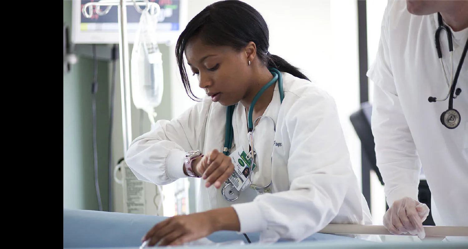 A nurse assessing a patient.
