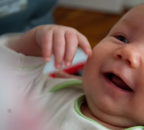 Photo of infant smiling.