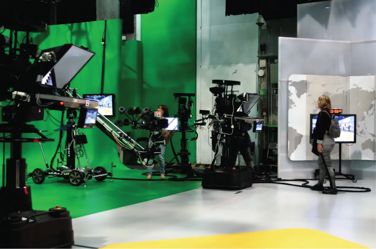 A television studio with a greenscreen setup.