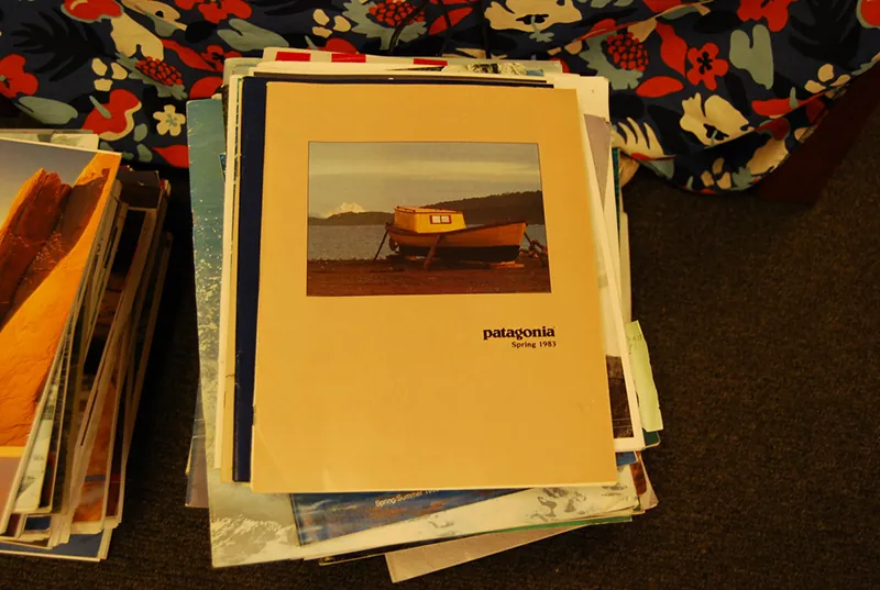 A pile of catalogs. The Patagonia catalog is visible on the top of the pile.