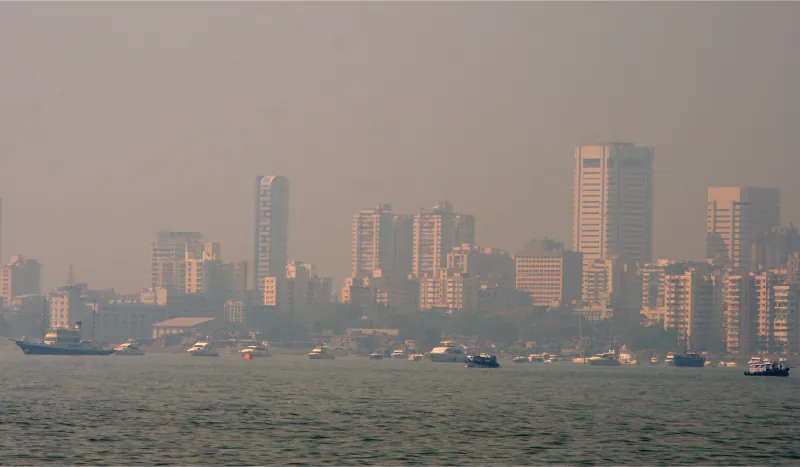 Photo of a city skyline clouded by smog.