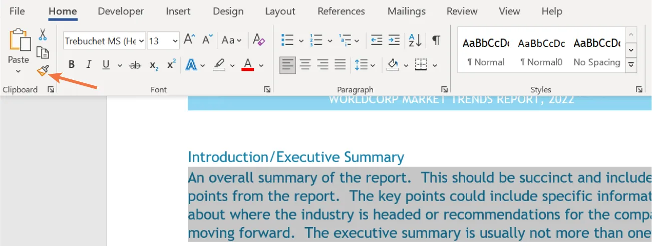 The Home tab is selected on the Ribbon and in the Clipboard command group Format Painter is selected. In the document, a paragraph with blue font is selected (highlighted in gray).