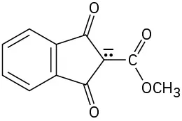 A structure comprising a benzene ring that is bonded to cyclopentane-1,3-dione. C 2 of the cyclopentane ring is attached to a methyl ester group and also has a lone pair of electrons and a negative charge on it.