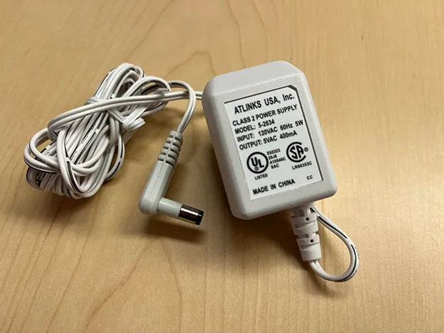 A photo graph of two plug in transformers operated on voltages other than common one hundred twenty volt AC.