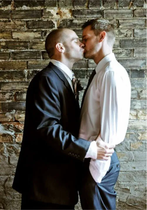 Photo of two individuals kissing.