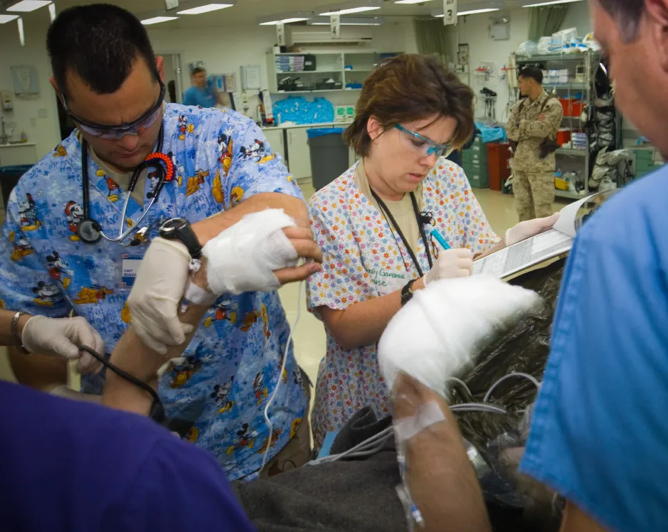 Healthcare professionals performing physical examination of patient