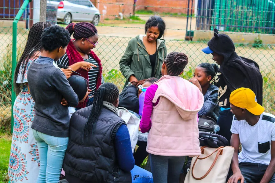 Photo of two individuals hugging.