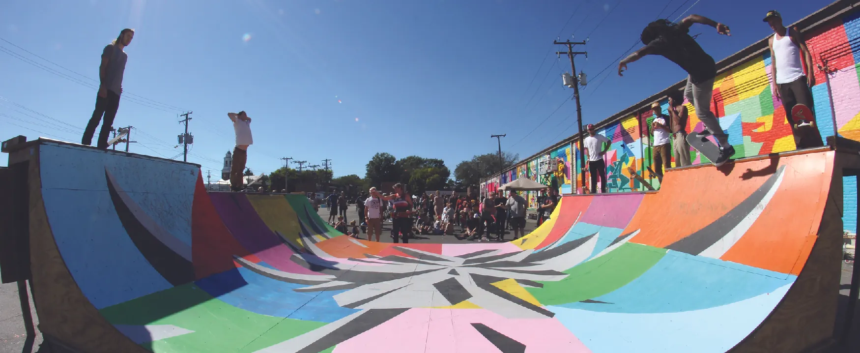 A photograph shows skateboarders on a skateboarding ramp.