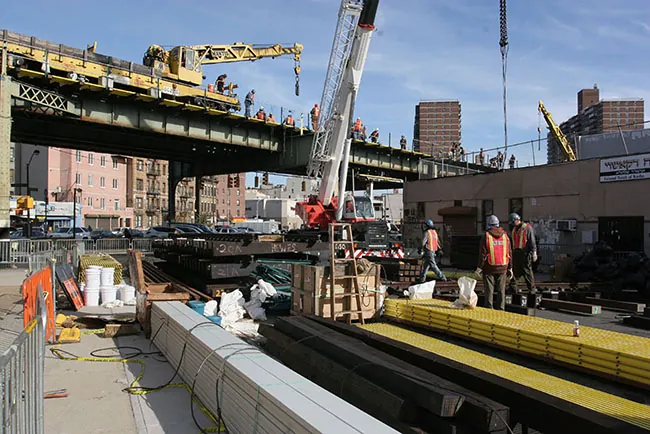 A photo shows construction workers working at a construction site.