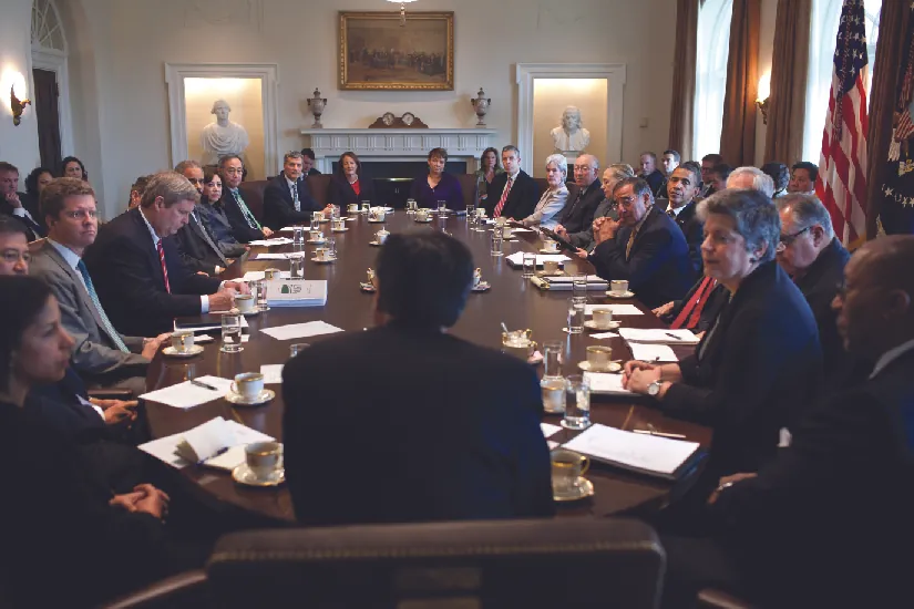 A photo of cabinet members holding a meeting in the Cabinet Room.