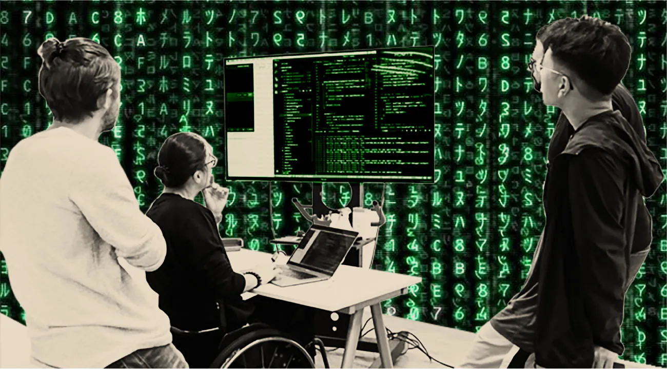 Three individuals are gathered around a large screen displaying code. One person in a wheelchair is seated at a desk with a laptop, while two others stand nearby, looking at the screen. The background is a green matrix-style digital pattern with glowing symbols and numbers.