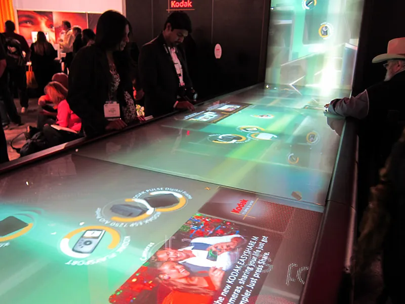 People interact with a digital waterfall at a shopping mall in France.
