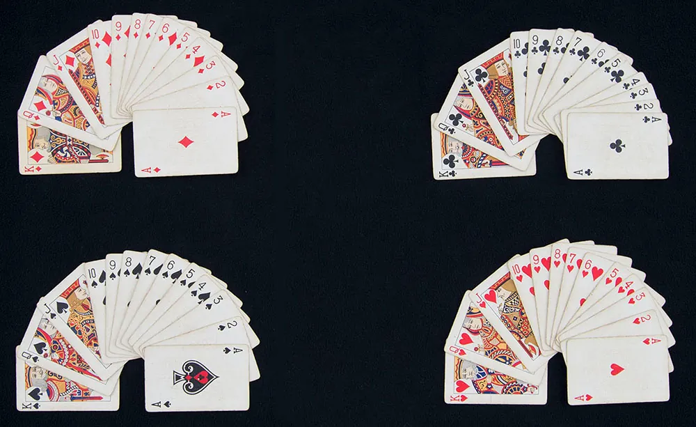 A deck of playing cards sorted by suit into 4 groups. Each group is arranged from largest to smallest value.