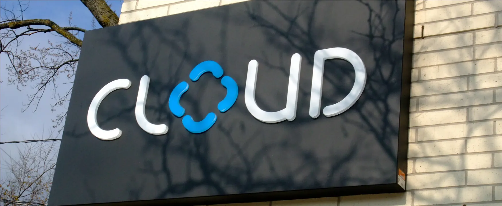A photograph of a building with a CLOUD sign.