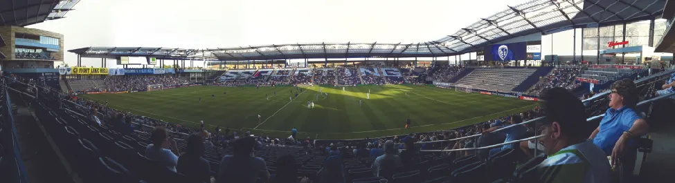 An image of the inside of a stadium. The stands are filled with people.