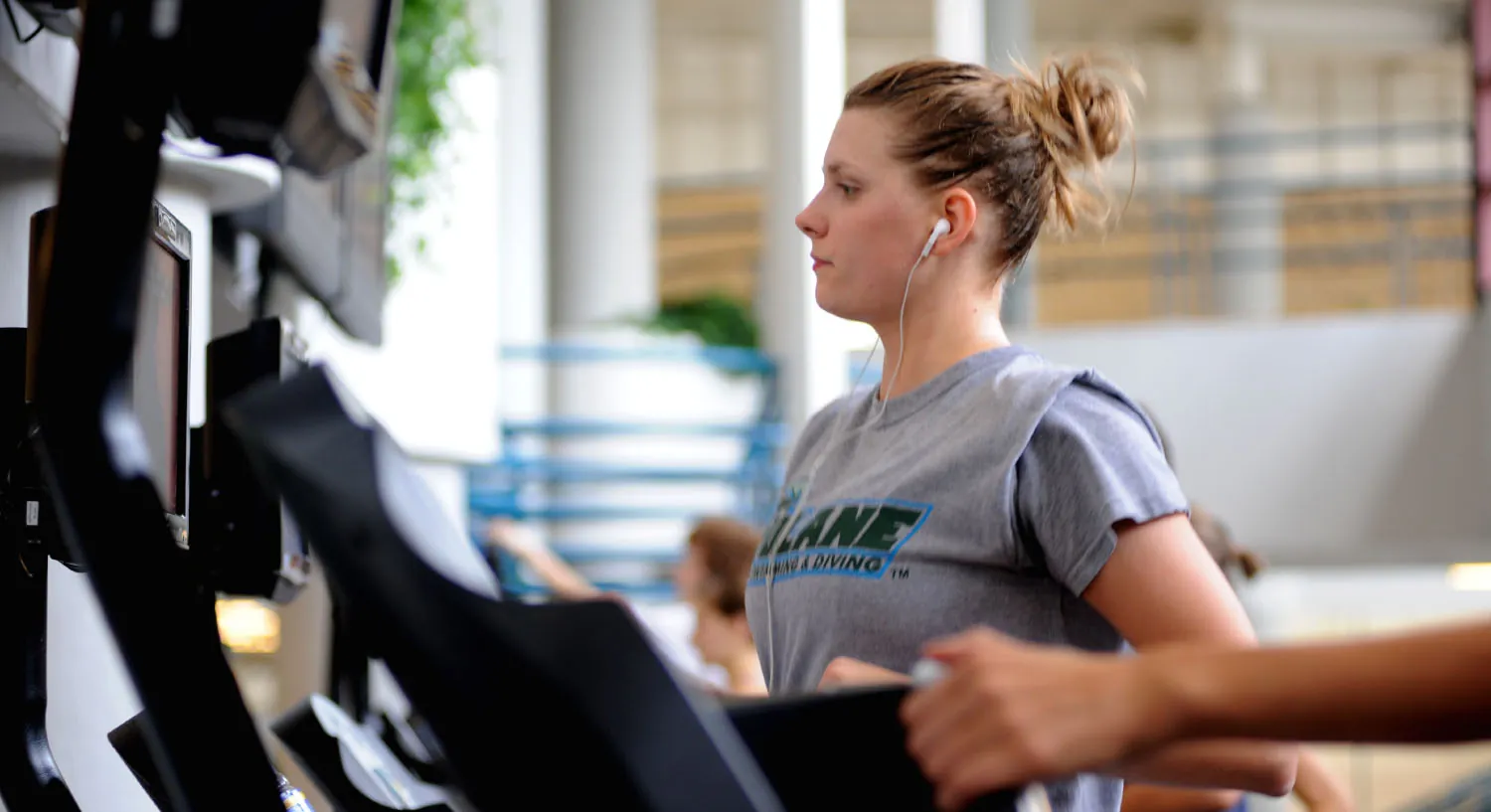 Photo of individual running on treadmill.