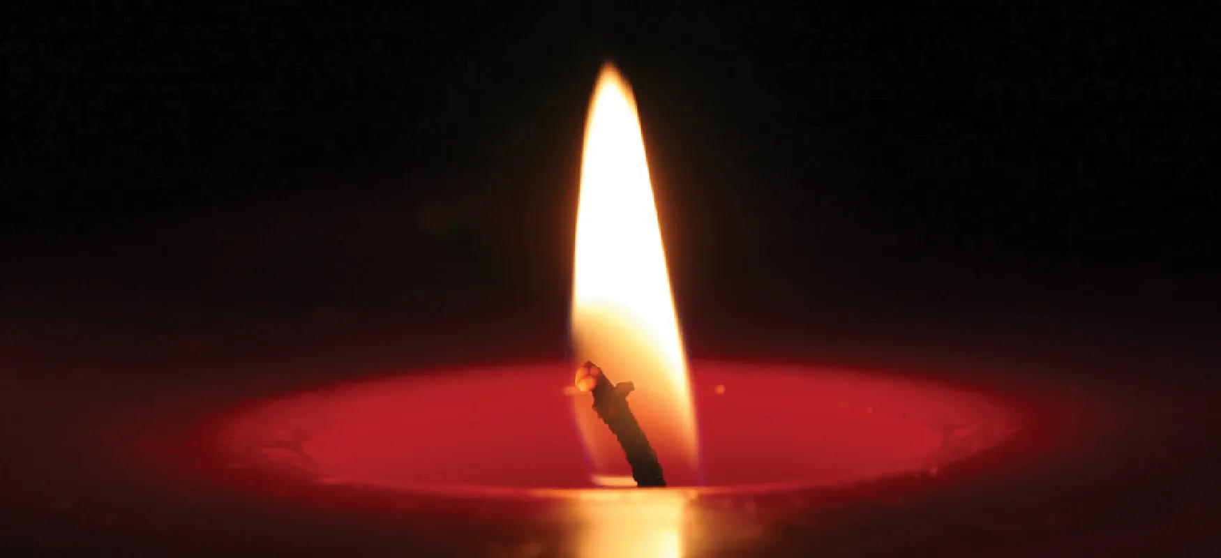Photo of a flame on a candle.