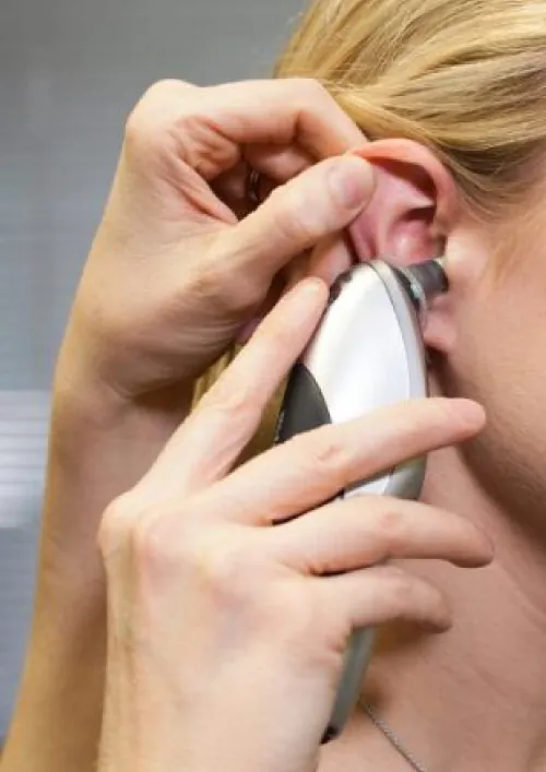 Patient having their tympanic temperature taken.
