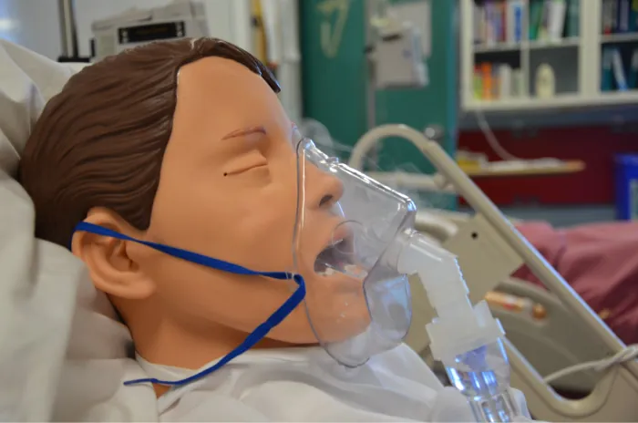 A dummy wears a nebulizer mask, used to administer inhaled medications.