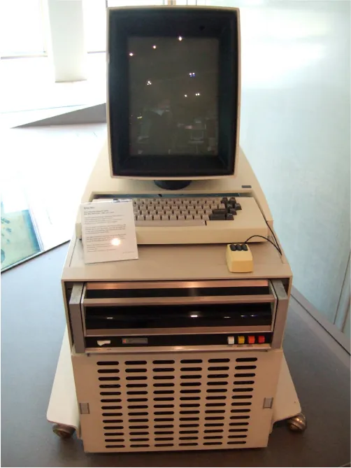 An computer is located on a wheeled platform. A vertical, rectangular screen sits on the top shelf with a keyboard and a mouse below.