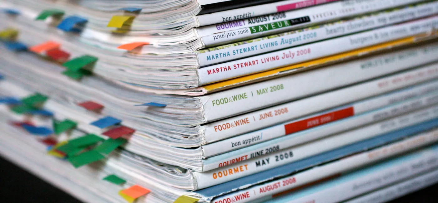 This is a photo of magazine spines. The magazines cover various topics like plants, food, and architecture.