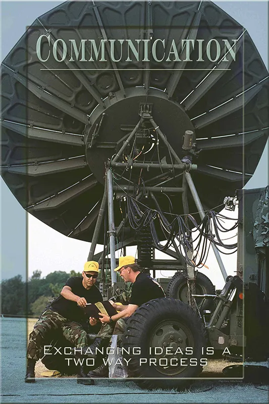 A poster shows a large antenna with the word “Communication” written above it. Two workers sit behind the antenna. The text below reads, “Exchanging ideas is a two way process.”