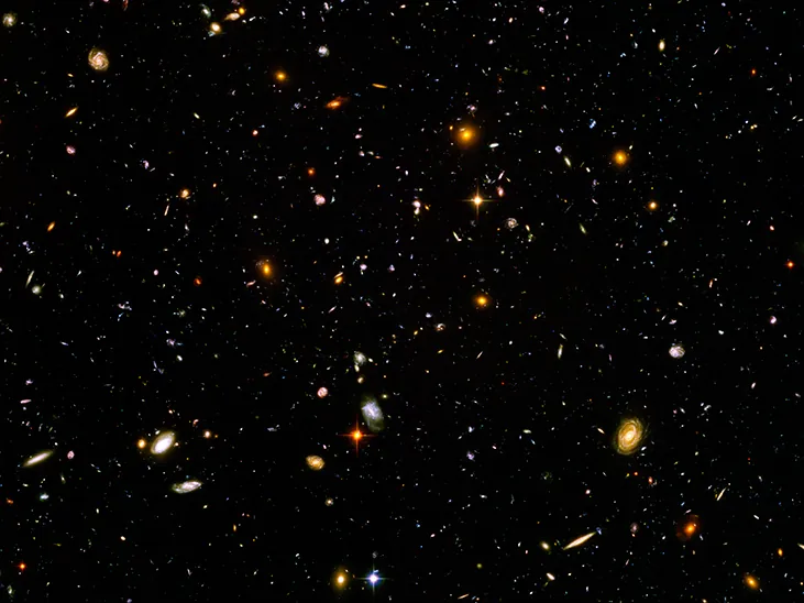 An image shows the stars and objects visible in the Ultra-Deep Field.