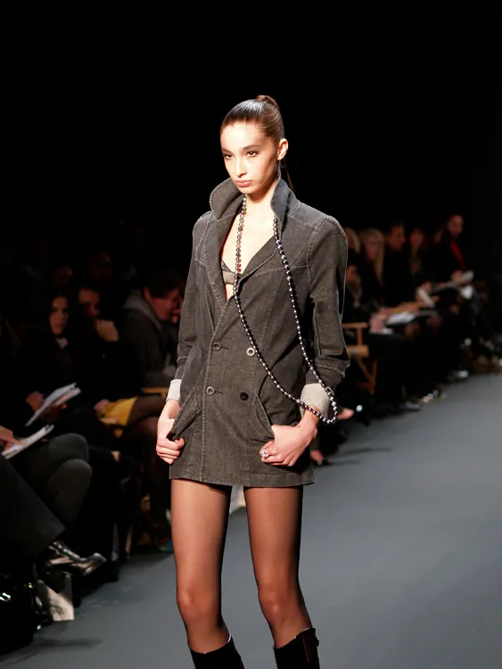 A thin female model is shown participating in New York’s fashion week.