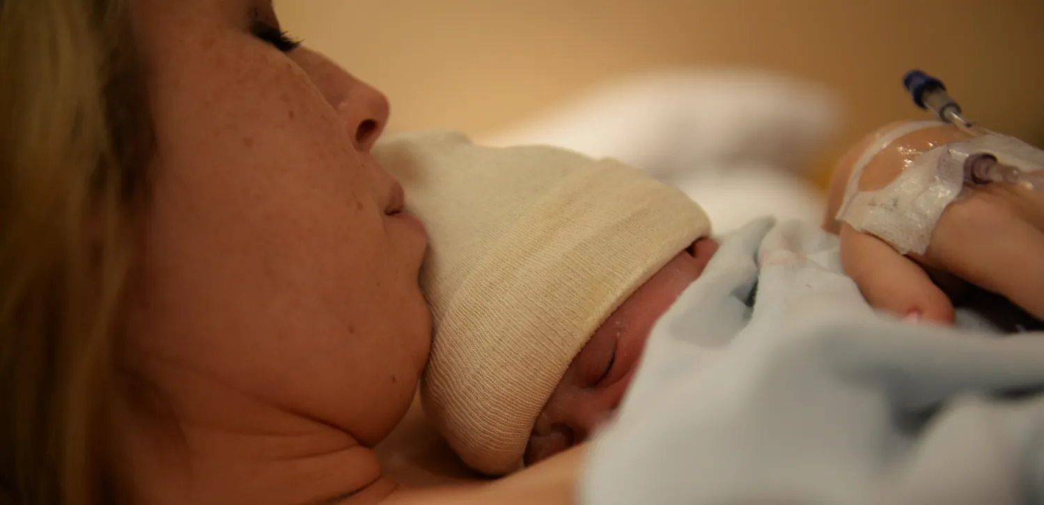 Image of mother holding newborn.
