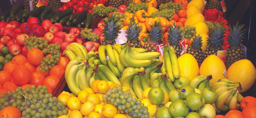 A photograph of different types of fruit at a market.