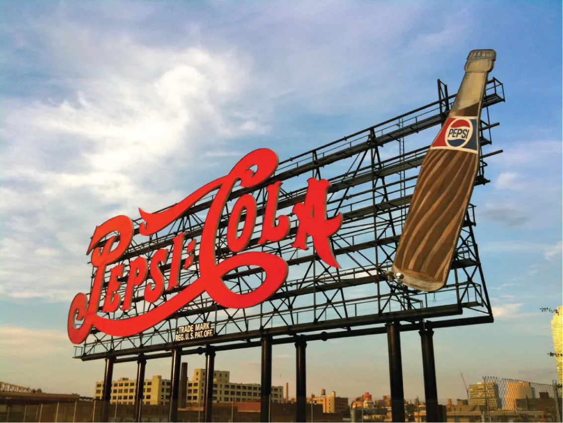 An image of a large Pepsi Cola sign along a highway in New York City.
