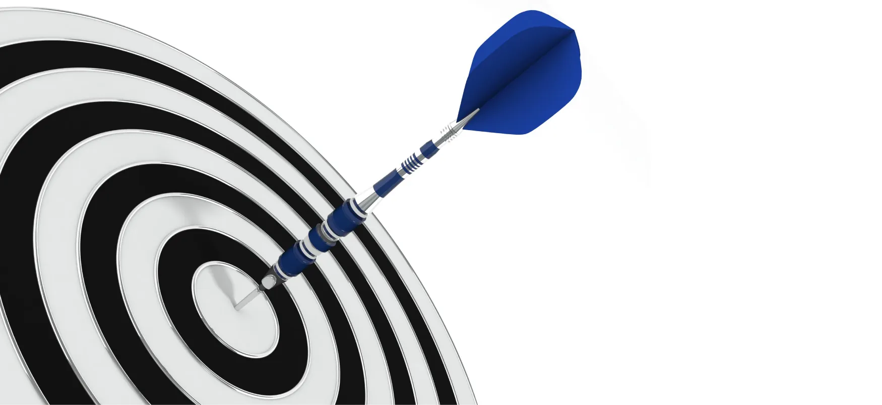 A dart is in the bullseye of a dartboard.