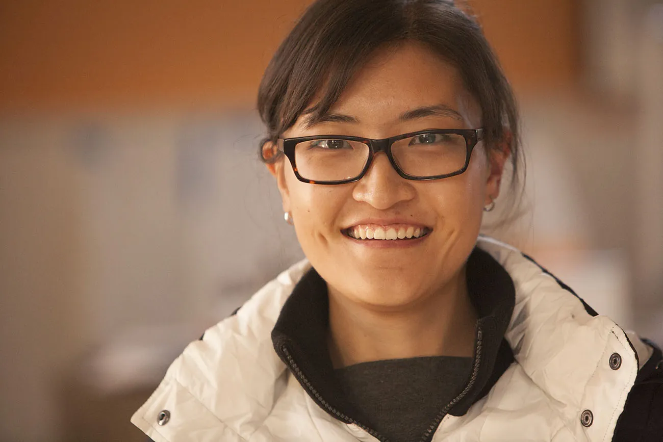 A photo shows a close-up portrait of Xinyu Liu posing at the camera.