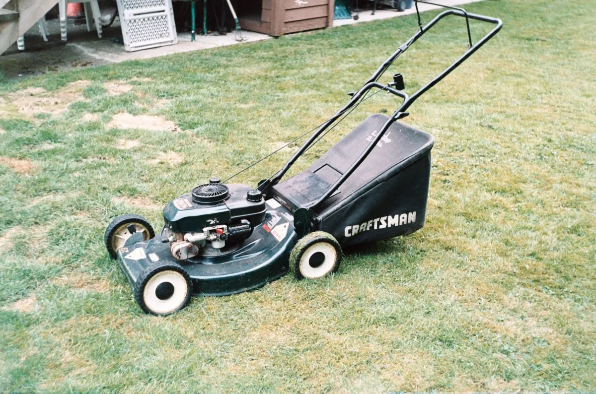 A lawnmower on a lawn.